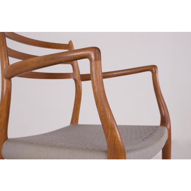 Niels otto møller for j.l. Møllers møbelfabrik, a chair with teak armrests, “model 62”, original edition from the 1960s. A...