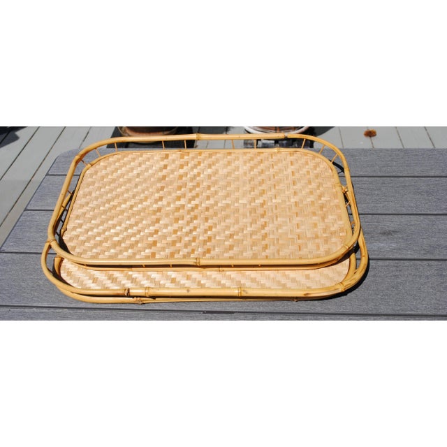 A Vintage pair of rectangular bamboo trays. Nice woven detailing with a bamboo rail, rounded corners, and wood...