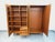 Vintage Scandinavian wardrobe from the 1960s, made of teak, with striking, airy, splayed legs. Ample storage: 4 doors with...