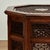 Standout antique Anglo Indian stand crafted in teak in an octagon form having a top with inlaid brass, center medallion...