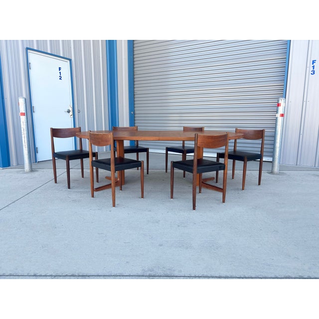 ✨ Danish Modern Dining Set with Poul Volther Chairs ✨ This 1960s Danish modern dining set is a stunning example of...