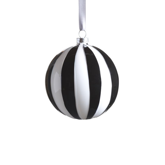 The Monochrome Stripe Glass Hanging Holiday Ornaments bring a touch of modern elegance to your festive decor. Each...