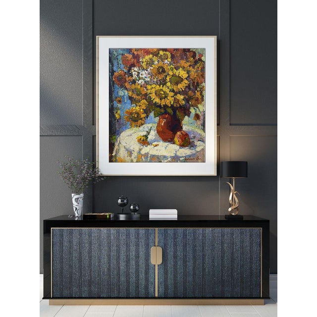 This oil painting, entitled ""Still life with sunflowers"", is a bright and cheerful example of the still life genre. The...