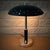 A Swedish modernist table lamp manufactured during the 1940s by an unidentified Swedish manufacturer. The lamp features a...