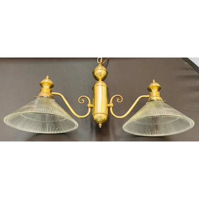 A classy and stylish Georgian style pendant or chandelier featuring two large flared glass shades facing downward. Each...