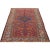 Antique handwoven Persian Malayer rug with a rust-colored background and ivory-colored border, accented with shades of...