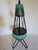 A pair of MCM Atomic wrought iron hairpin tripod teal green ceramic table lamps. Beautiful and rare set featuring a...