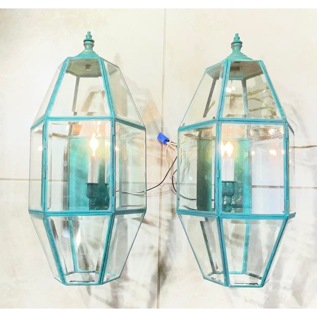 Transform your indoor or outdoor living space with this magnificent pair of vintage solid brass wall lanterns, masterfully...