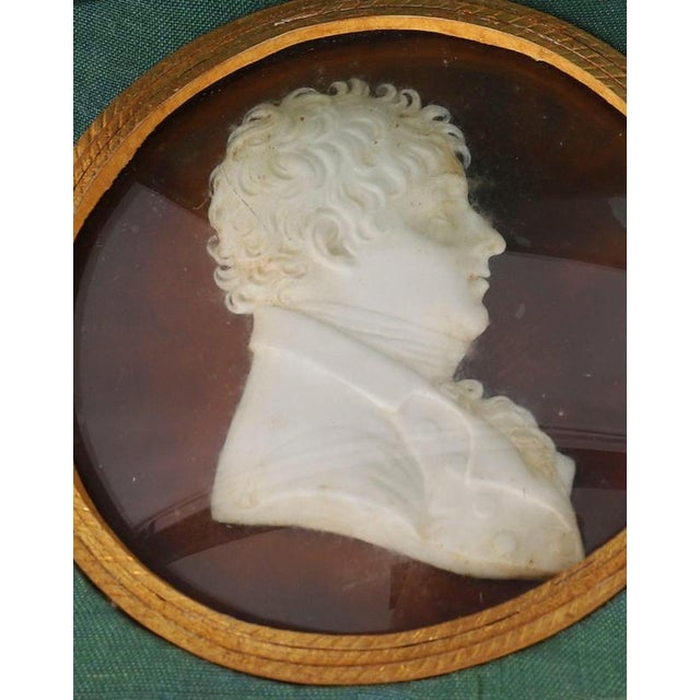 A pair of Continental wax portrait reliefs of Mr and Mrs Luke Foreman, early 19th century in date. Each set against a...