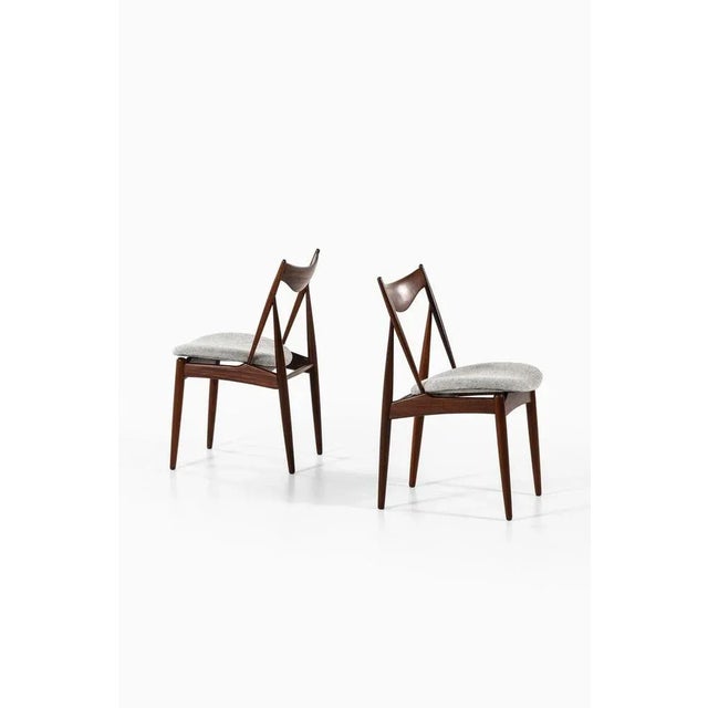 Very rare set of 10 dining chairs designed by Kurt Østervig. Produced by Bramin in Denmark. This piece is attributed to...