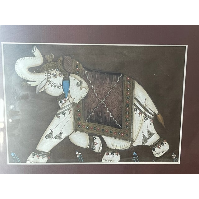 Original painting on silk of an elephant framed in gold tone frame.