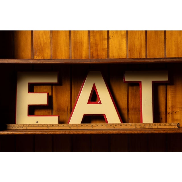 Vintage decorative porcelain letters. These pieces, sold as a set, feature an off-white coloration with thin red trim...
