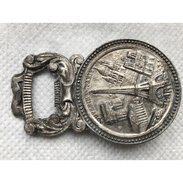 Metal collectible with bottle opener, Napoleon Paris 1950s in silver. Dimensions: height - 8.5 cm. Width - 5.4cm. Depth -...