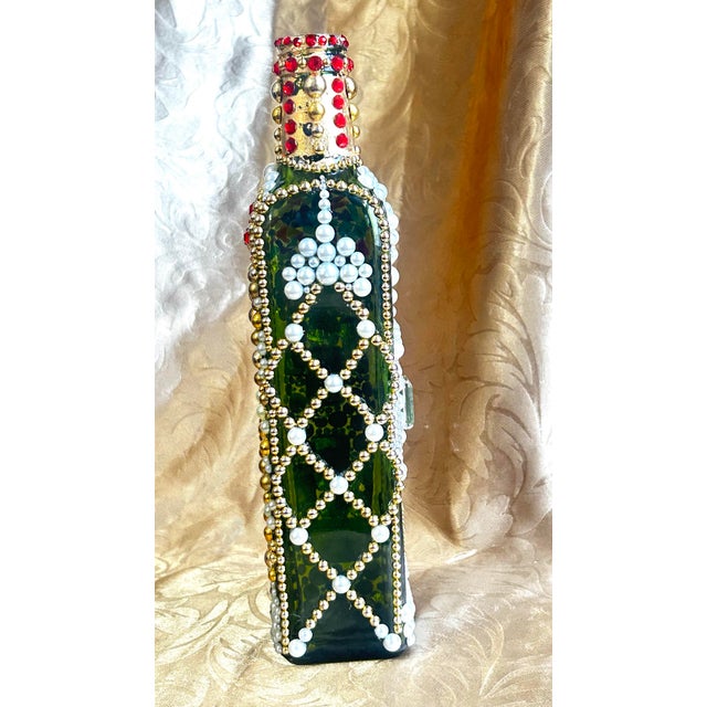 This piece underwent a 15-day hand-armoring process, where thousands of individual pearls and crystals were meticulously...