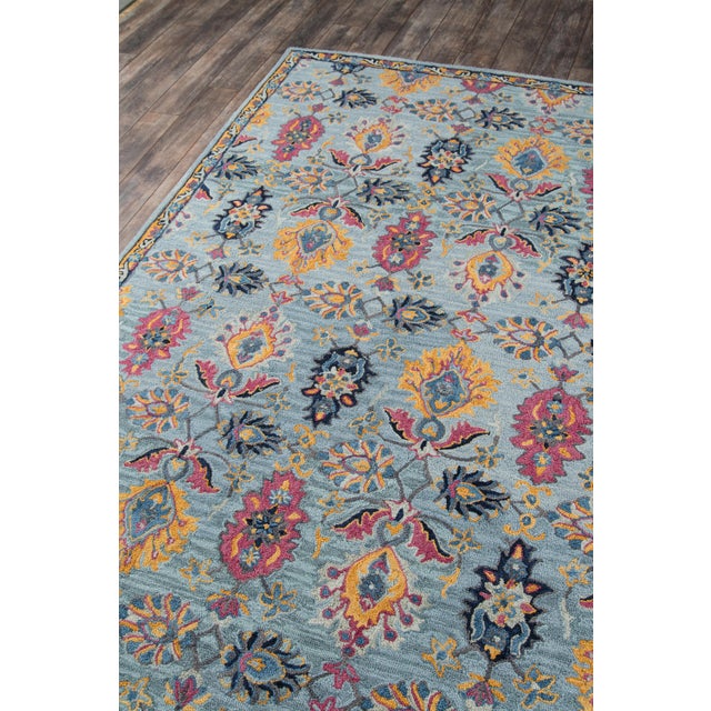 The saturated shades of this decorative area rug reinvent the classic Persian carpet in a vivid color palette. The...