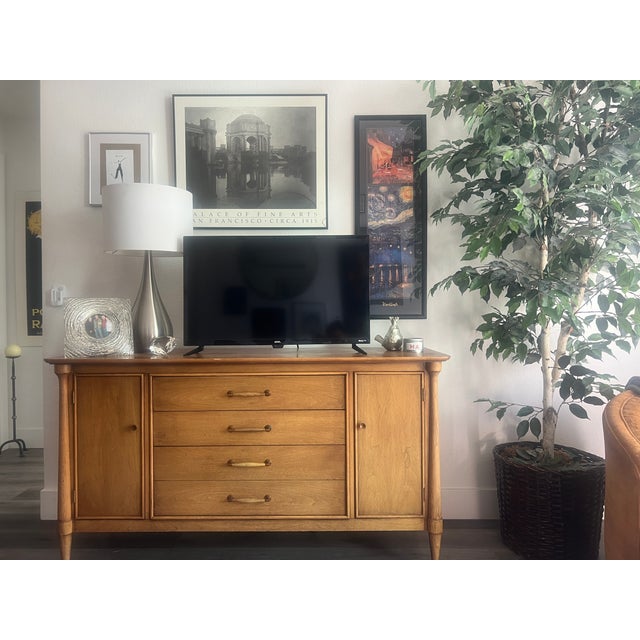 Stunning, high-quality Mid-Century Modern solid teak credenza, c. 1960s. This piece offers both beautiful design and...