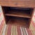 A lovely walnut nightstand or side table with additional storage. There is one drawer, and one adjustable shelf. I believe...