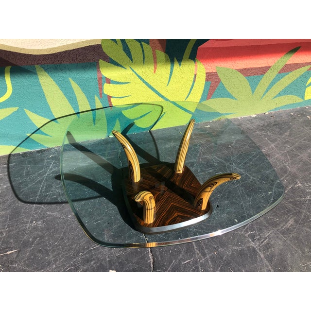 Elegance and exotic in one! From the 70s, this coffee table has a great blend of varying woods to tie in to a slew of...