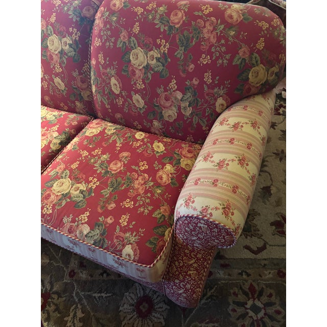 Cheerful floral loveseat, inspired by Laura Ashley era floral nd stripe motif in vibrant rose tones, detailed piping,...
