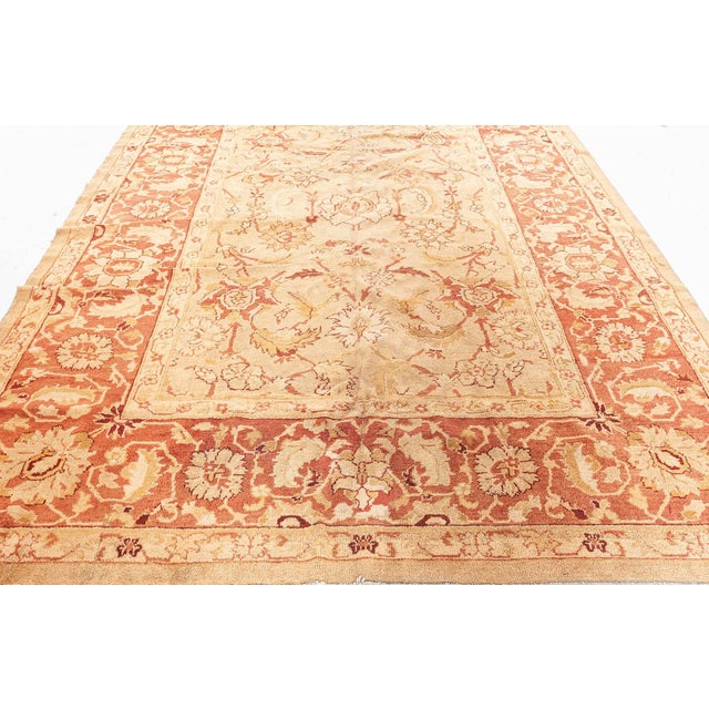 An early 20th century Indian Amritsar antique carpet, the pale beige field with an overall large-scale design of vitality...