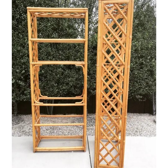 A fabulous 1970's cane wrapped split bamboo etegere' with glass shelves. The open weave of the bamboo combined with glass...