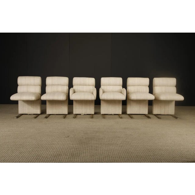 An intriguing and rare set of six vintage dining chairs by Finesse Furniture Ltd., comprised of four side chairs and two...