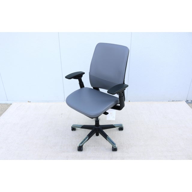 Amia is a versatile ergonomic office chair designed to handle long hours of sitting. Features adjustable LiveLumbar...