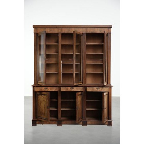 This antique English buffet cabinet/bookcase dates from the late 19th century and features the original glass. The cabinet...