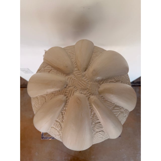 Contemporary coastal decorative sculpture inspired by a sea urchin shell, featuring a soft ivory finish with sculpted...