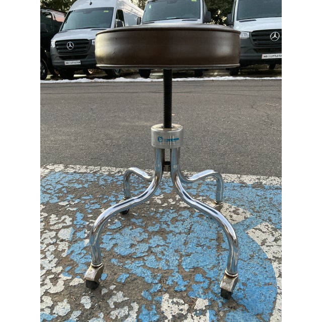 Vintage industrial swiveling medical or drafting stool, vinyl and chrome, by E.F. Brewer Company. Seat height adjust from...