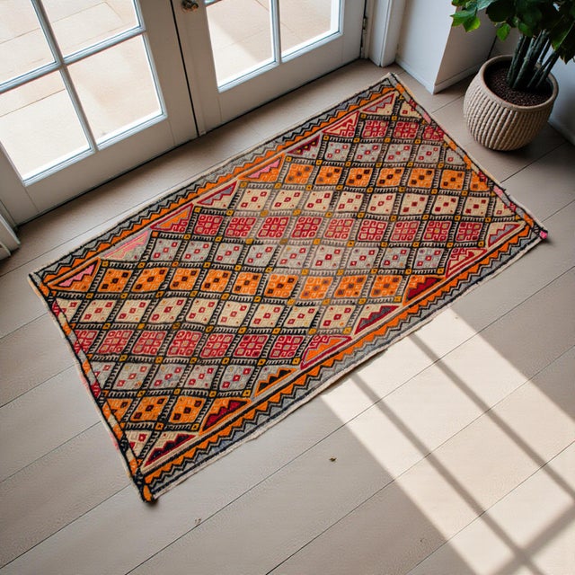 This hand-woven Sivrihisar kilim captures the vibrant essence of Anatolian flat-weave artistry, blending geometric...