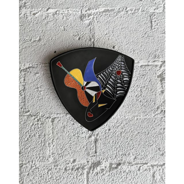 This decorative wall plate was produced in the 1950s by KETO-Keramik as model no. 304 from the "Bohemé" series. Typical...