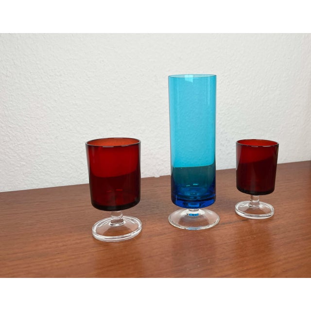Blue glass is probably a different manufacturer This piece has an attribution mark, I am sure that it is completely...