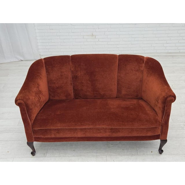 1950s, Danish 2-seater sofa. Furniture velour, oak wood legs, brass springs in the seat. Sofa was reupholstered by...