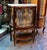 Elegant and richly detailed, this French Louis XV-style display cabinet is crafted from solid wood and designed to...