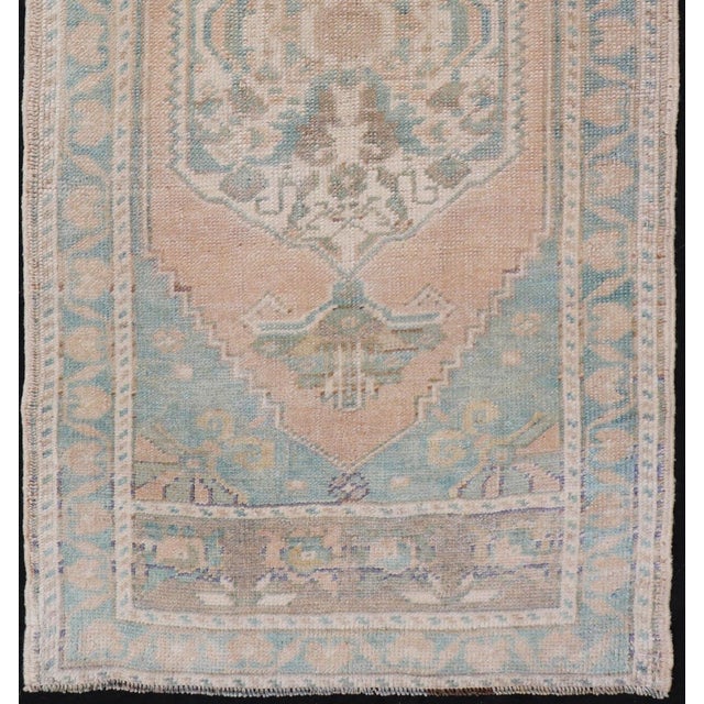 Measures: 1'10 x 4'0 Vintage Turkish Oushak Rug with Soft Peach Field and Pale Aqua Accents. Keivan Woven Arts /...
