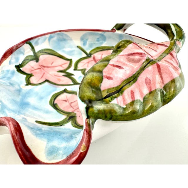 This vintage Italian decorative bowl is a splendid example of hand-painted ceramics, featuring a lively depiction of pink...