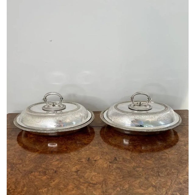 Quality pair of antique Edwardian silver plated oval entree dishes having a quality pair of silver plated oval entree...