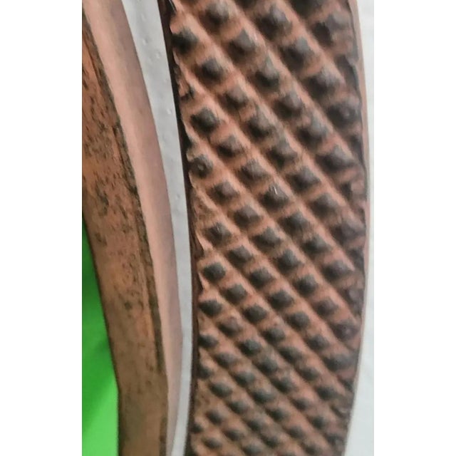 A sweet very heavy iron double palm tree wall mirror. The mirror features very heavy iron surround in a bronzy rust finish...