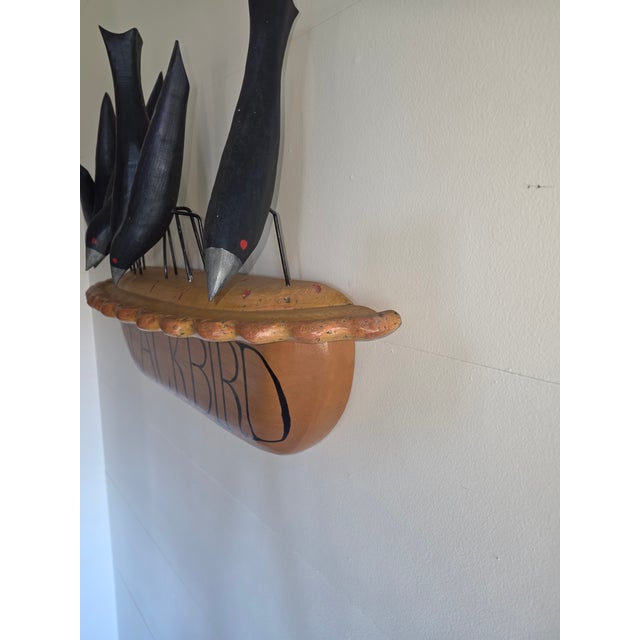 Interesting vintage hand carved and painted black bird pie sculpture.. Each bird has two wire prongs and the wood pie has...