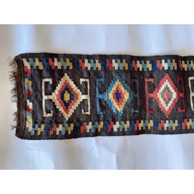 Long Central Asian natural dyed wool flat weave tent band runner, with traditional geometric design. Measures 65" length x...