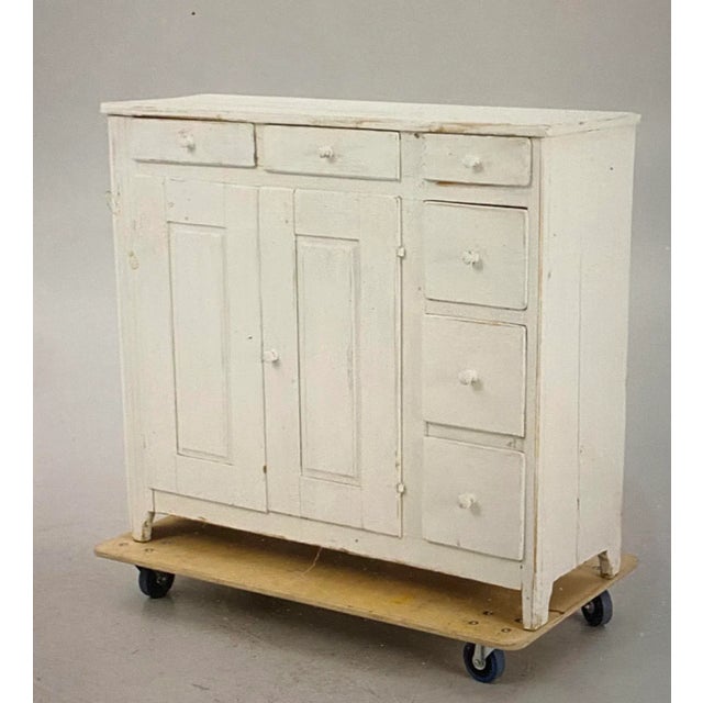 Sideboard with two large flaps and six different drawers. Inside there are two shelves. Brightly colored and with conical...