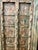 This antique door makes a haute bohemian statement used as wall decor or entry door. At the top, two hand-carved figural...