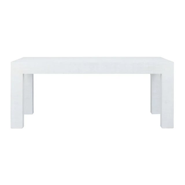 Classic lines make this white raffia wrapped coffee table easy to use in both modern and traditional settings. It creates...