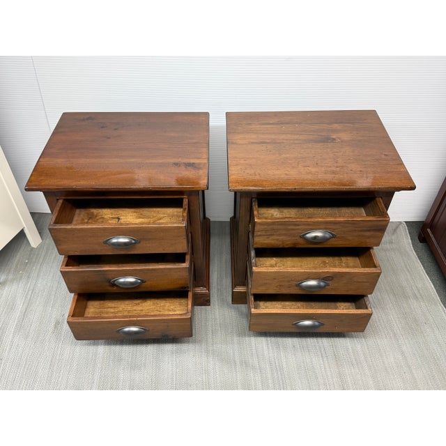 Design Plus Gallery presents a Pair of Rustic to Mission Style Nightstands. These bedside tables have a dark stain to...