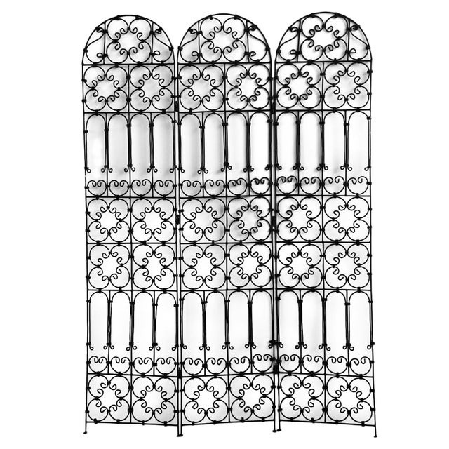 Vintage black folding three panel black iron screen with Moorish decorative pattern. Great for use indoors or out.