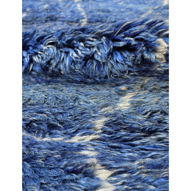 Blue Beni Mrirt Rug | Handwoven Berber Wool Rug with Shaded Indigo Field and Cream Lattice This deeply saturated blue Beni...