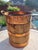 A handsome mid‑century oak firewood bucket featuring copper metal bands and solid brass swing handles. The piece has a...