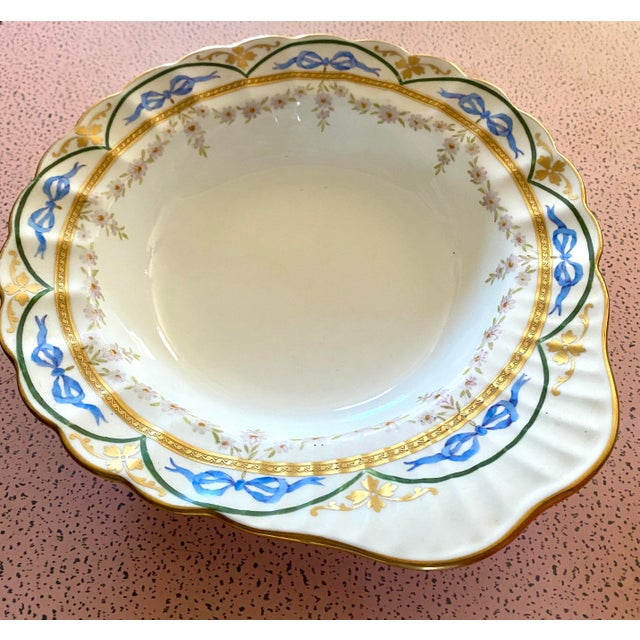 This Wedgwood England Porcelain Oval Berry Bowl in Ribbons and Roses Harlequin is a beautifully crafted serving bowl made...
