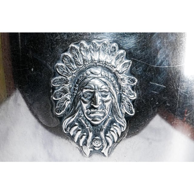 This exceptional American sterling silver trophy, dated August 21, 1915, is a striking example of early 20th-century...